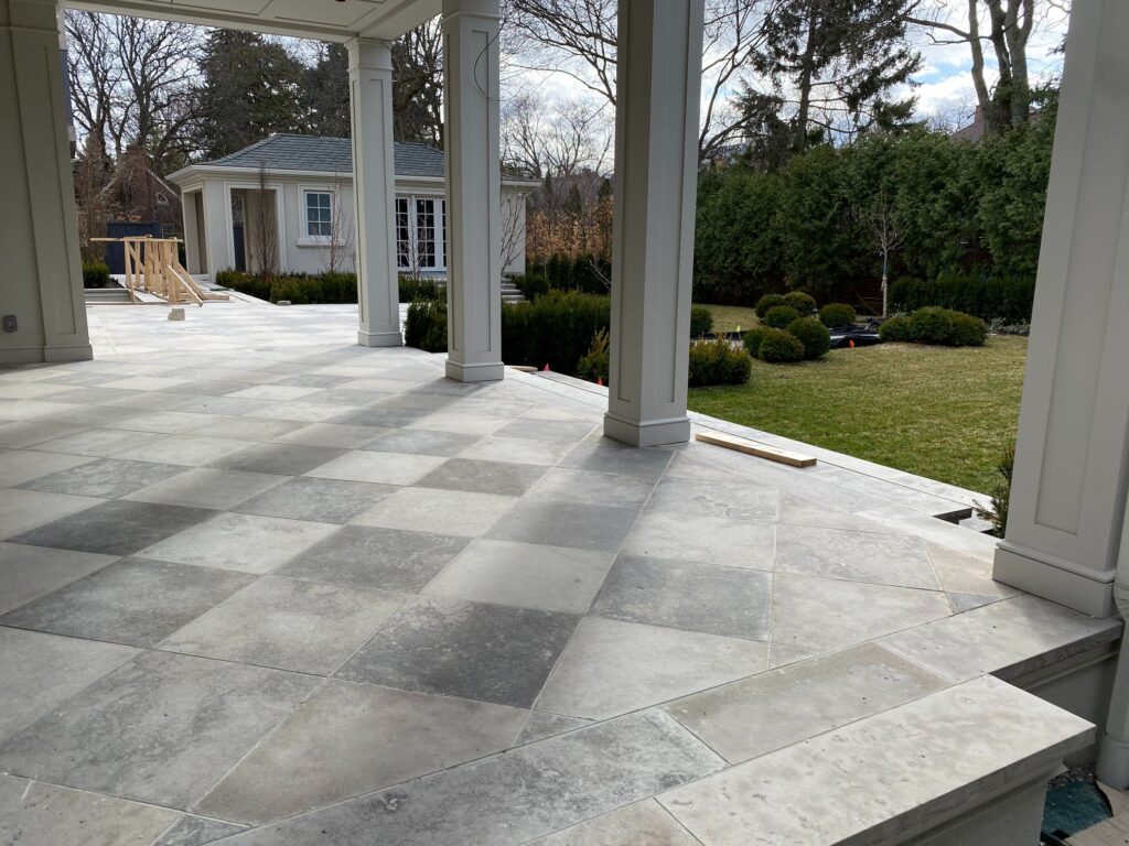 interlocking paver tile installation to outside of the house